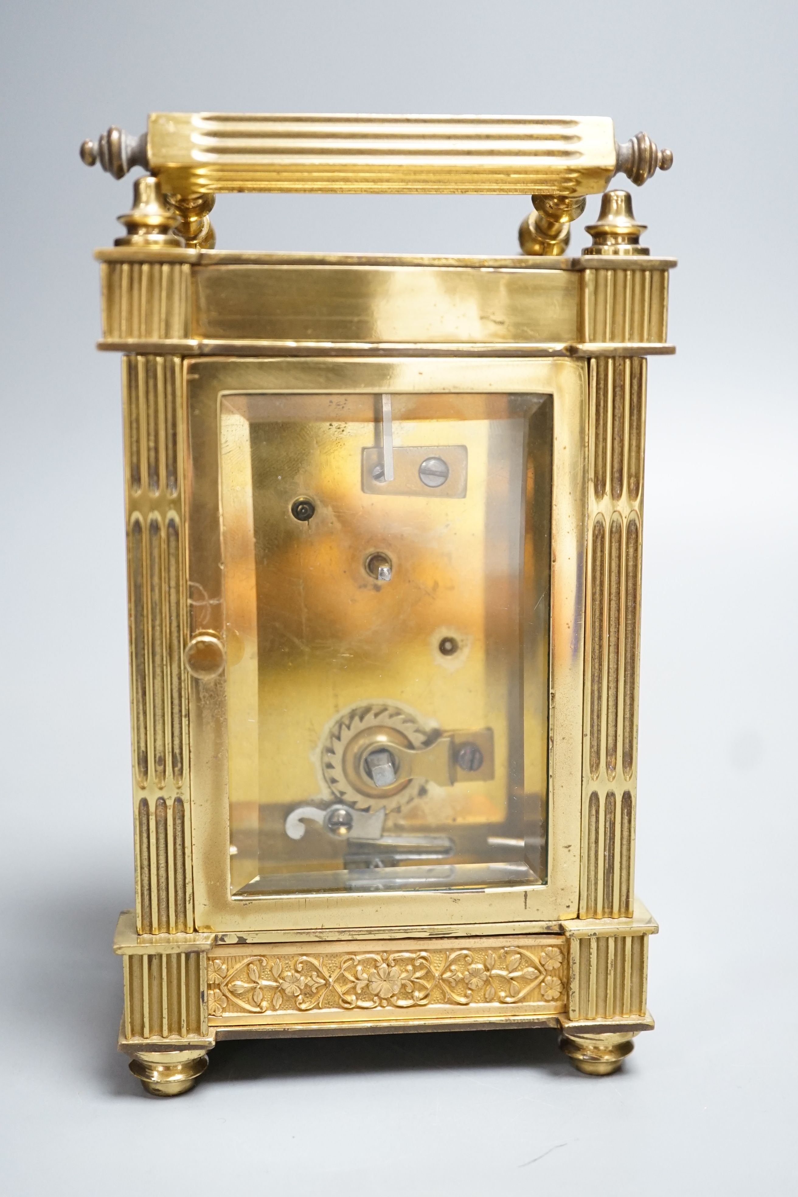 An early 20th century French brass carriage timepiece with fretted dial. 15.5cm